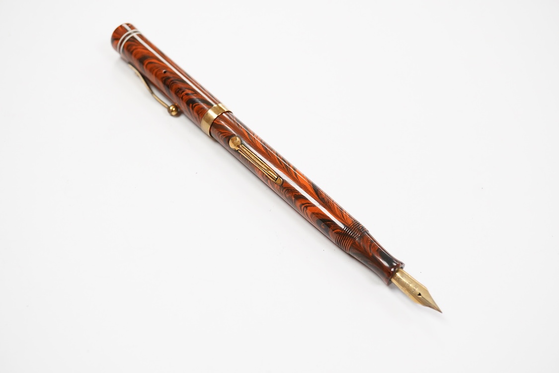 A Waterman Red Ripple No. 5 lever fitted with red cap band and filled with No.2 Waterman nib